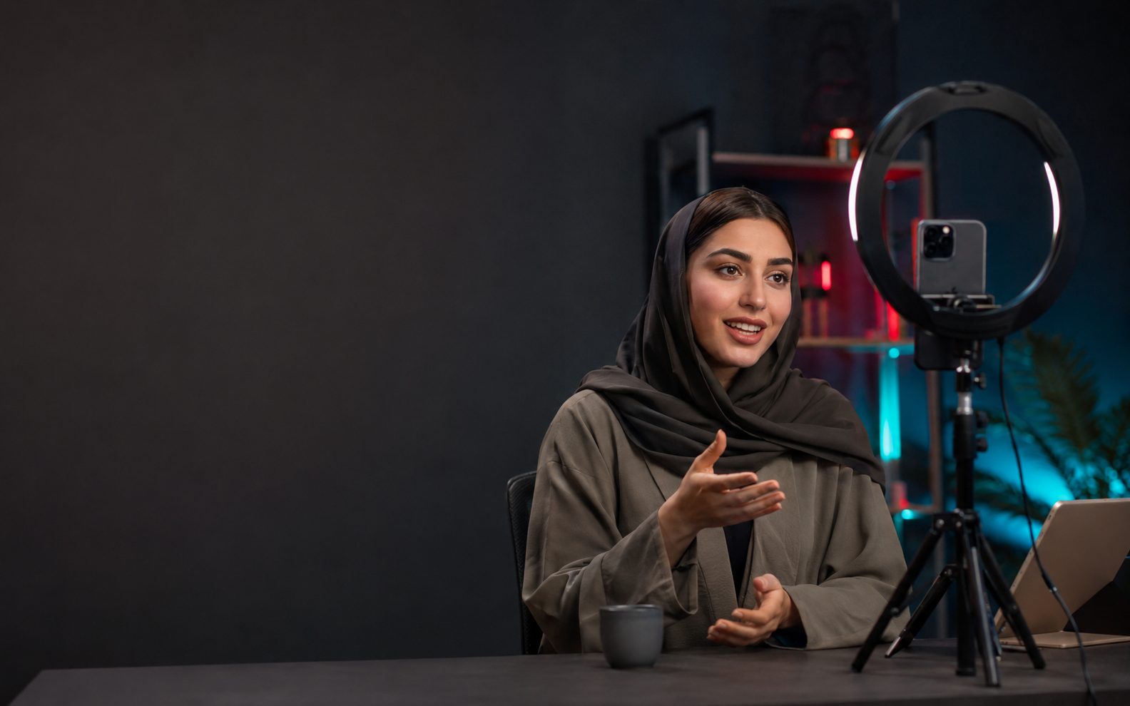 ORO Live creator hosting a TikTok LIVE stream with a ring light and phone